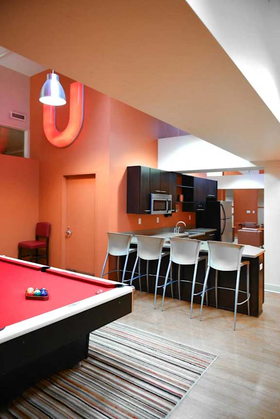 a room with a pool table and a bar at Market Square Place, Pittsburgh, PA, 15222