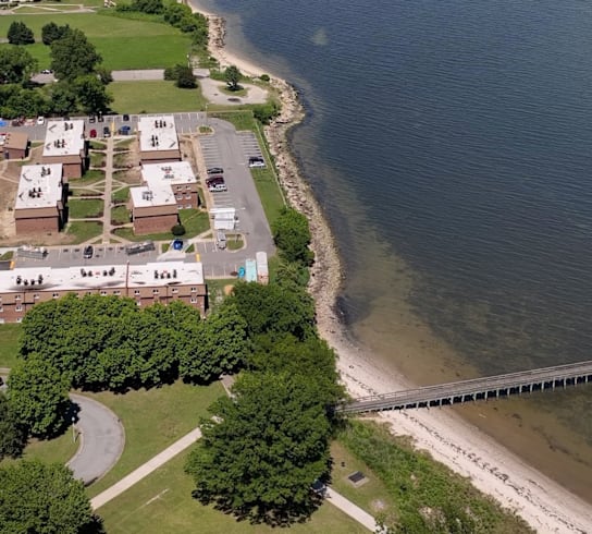 an aerial view of the shoreline of a beach and a body of water