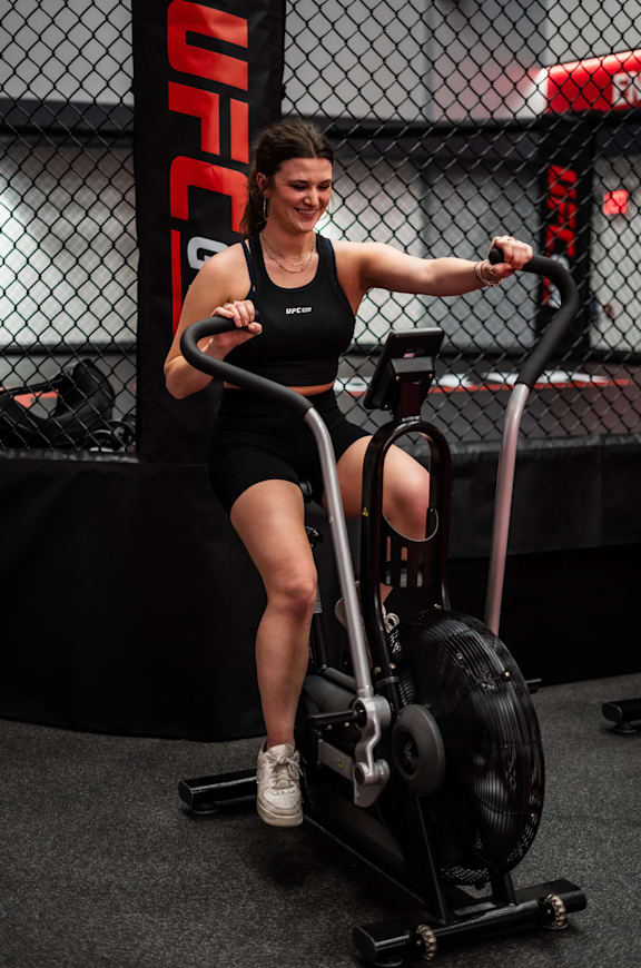 a woman using a cardio machine in a gym at Market Square Place, Pittsburgh, PA, 15222