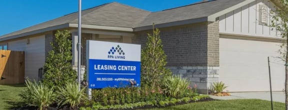 a house with a lease start sign in front of it