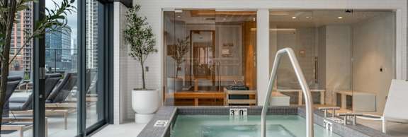 A modern indoor swimming pool with a slide.