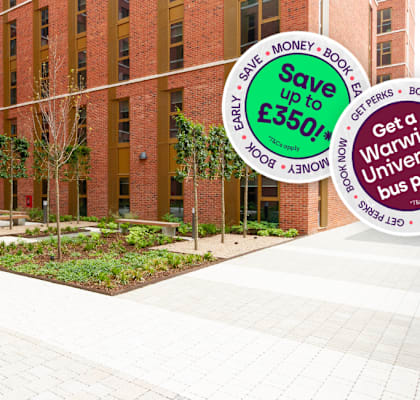 A building with a garden in front and signs offering discounts on university passes.