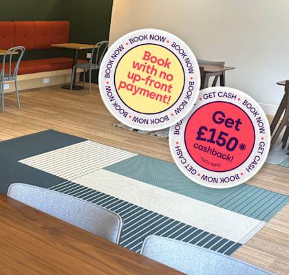 A sign in a room with tables and chairs advertises a 150 pound discount.