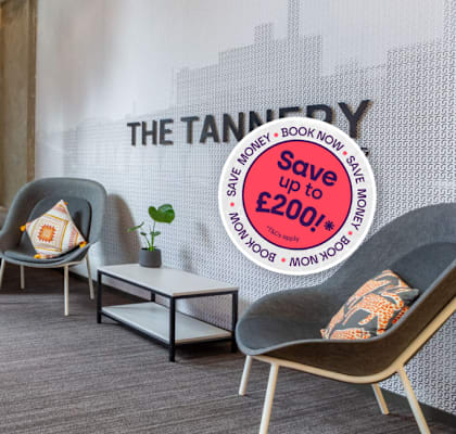 A room with a sign that says "The Tannery" on the wall.