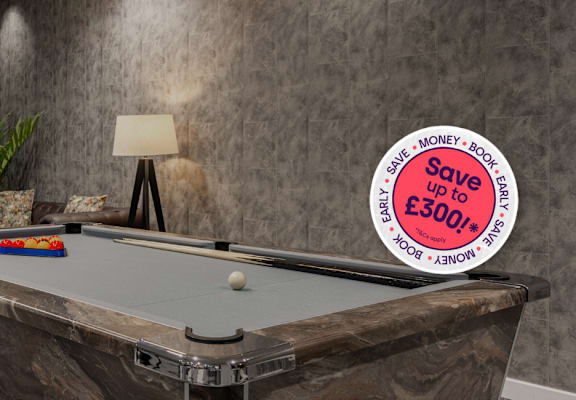 A pool table with a sign that says "Save up to £300".