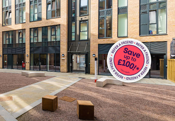 A courtyard with a sign that says "Save up to £100".