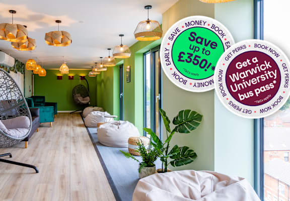 A room with a green chair and a sign offering a discount on a university bus pass.