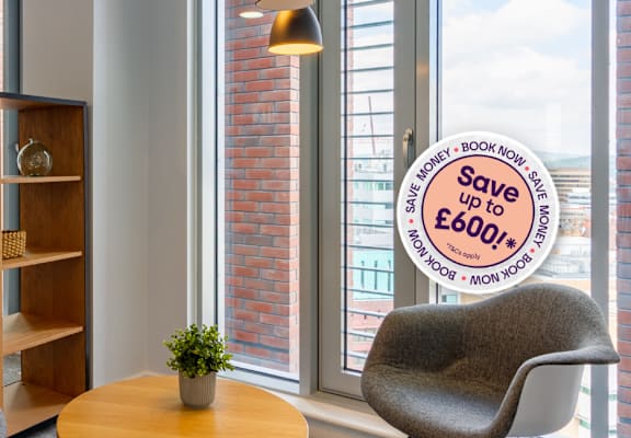 A room with a shelf, two chairs and a sign that says "Save up to £600".