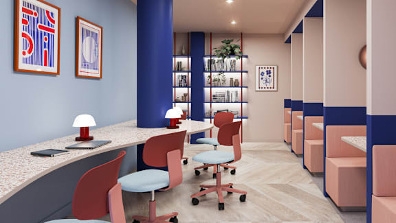 A row of red chairs are lined up in a room.