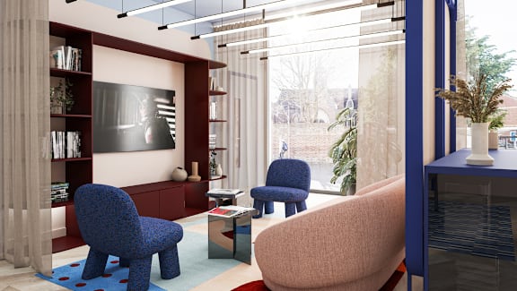 A modern living room with a blue chair and a television.