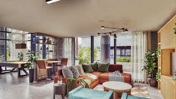 A modern living room with a large window and a variety of seating options.