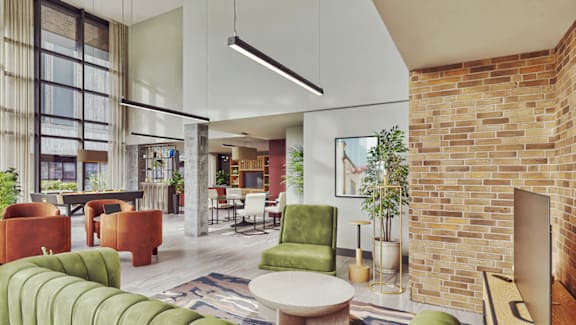 A modern office space with a brick wall and a variety of seating options.