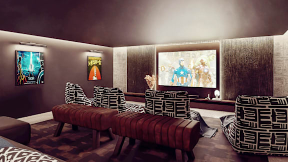 A living room with a large screen TV and a couch.