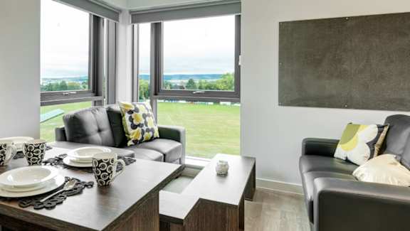 A modern dining room with a view of the outdoors.