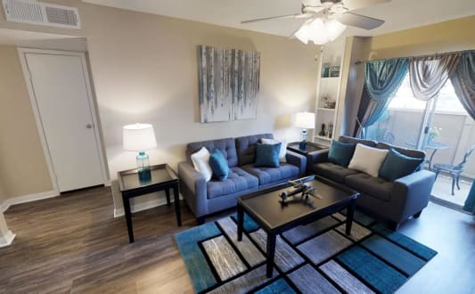a living room with couches and a coffee table