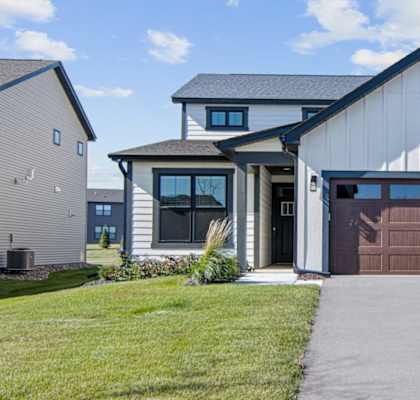 a house with a brown garage door