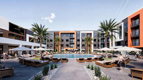 A resort with a pool and palm trees.