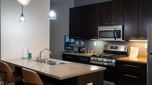 a kitchen with a sink and a counter top at Market Square Place, Pittsburgh, PA, 15222