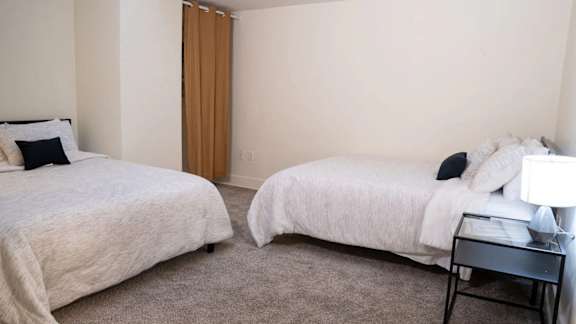 a bedroom with two beds and a night stand at Market Square Place, Pittsburgh, PA, 15222