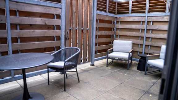 a patio with chairs and a table at Market Square Place, Pittsburgh, PA, 15222