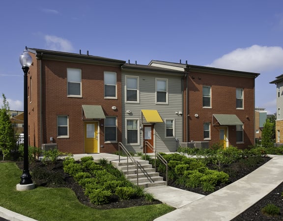 a row of apartment homes on a city street
