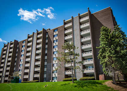 a large building with trees in front of it