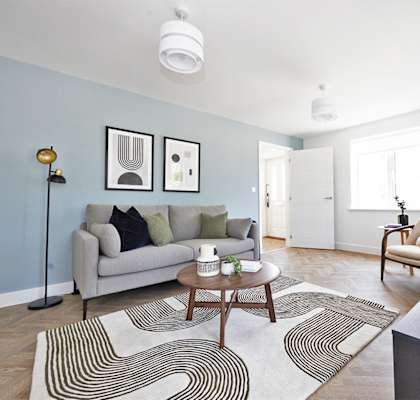 a living room with blue walls and a couch and a coffee table