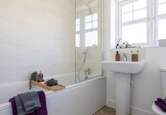 a bathroom with a sink and a bath tub and a shower