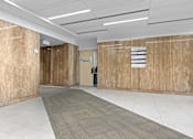 Thumbnail 2 of 13 - A hallway with a carpeted floor and a sign on the wall.