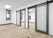 Thumbnail 4 of 5 - Three glass doors in a white room.