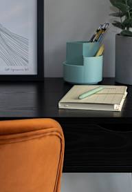 a bedroom with a bed and a nightstand with a lamp and a framed picture