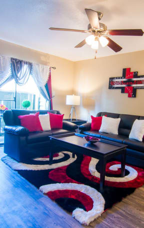 living room at the heights at harper's preserve apartments in conroe, tx