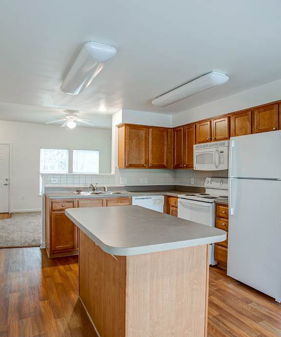 a model unit kitchen with an island for Metropolitan Village and Cumberland Manor
