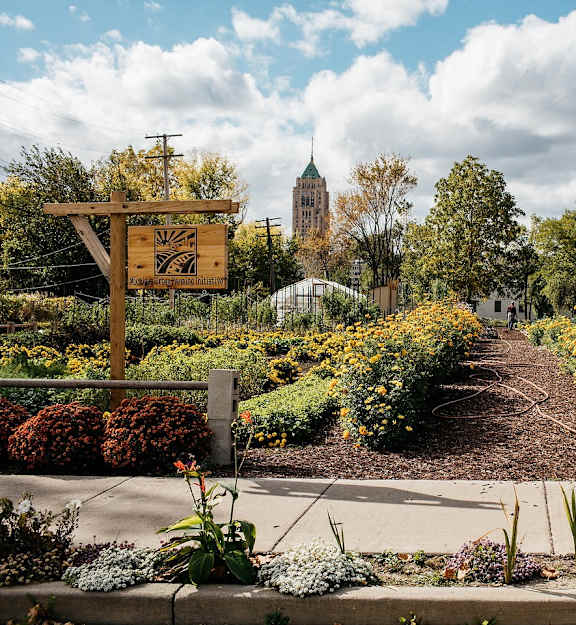 A garden with a sign that says "CLOSED" is in the foreground.