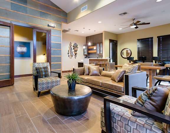 the lobby of a building with a fireplace