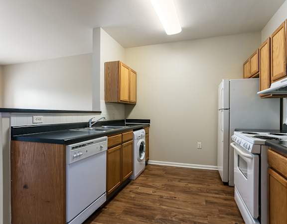 A kitchen at Jazz District apartments and townhomes in KC