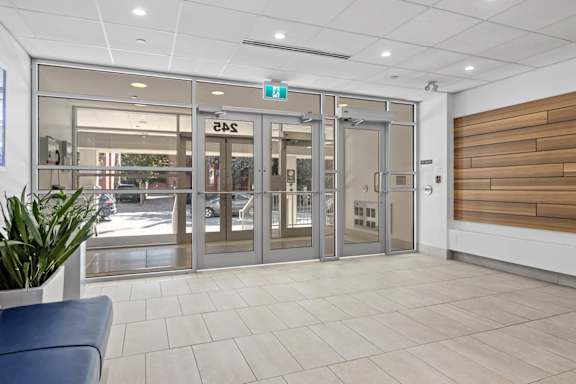 A set of double doors with a glass panel and a sign above it that says "EBS".
