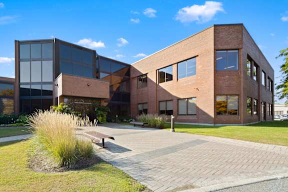 A modern building with a brick facade and large windows.