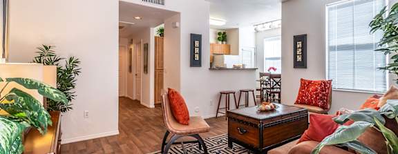 a large clubhouse kitchen and dining area with a fireplace and a table and chairs