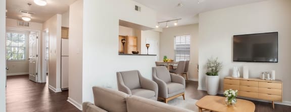 a large clubhouse kitchen and dining area with a fireplace and a table and chairs