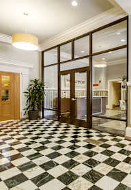A black and white checkered floor in a hallway.