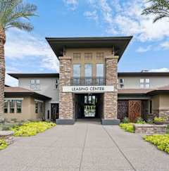 A building with a leasing center sign in front of it. at The Laurel Apartments, Chandler Arizona