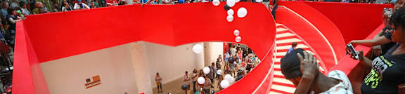 people taking pictures of a large red heart shaped structure in a room at Parcels at Concourse, Memphis, TN, 38104