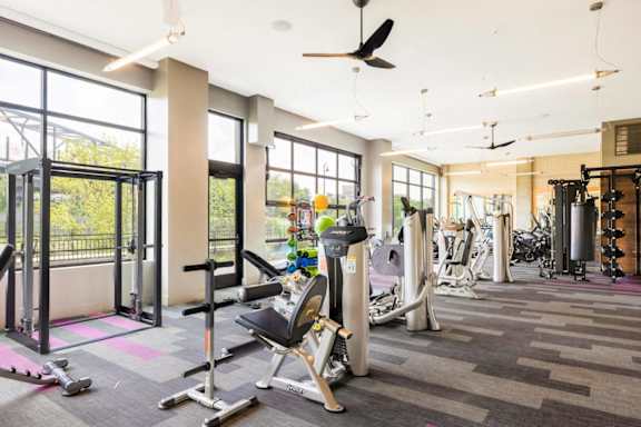 A gym with a variety of equipment including weights and cardio machines. at Coda at Bryant Street, Washington, DC 20002