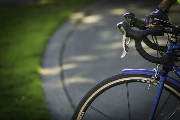 a bike parked on the side of a road