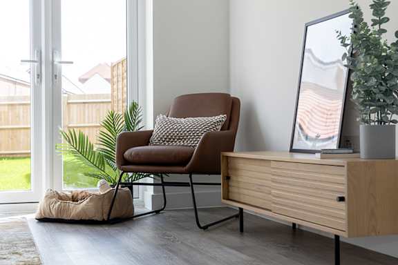 a living room with a couch and a glass table