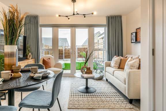 a living room with a couch and a glass table