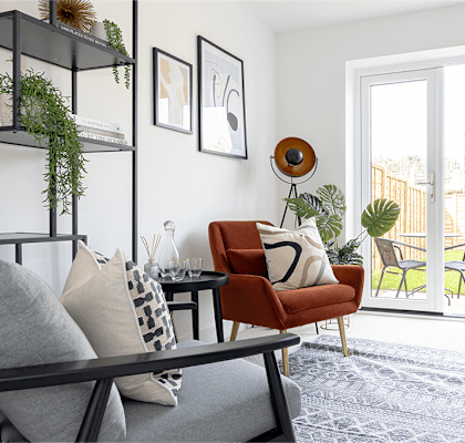 a living room with a couch and a door to a patio