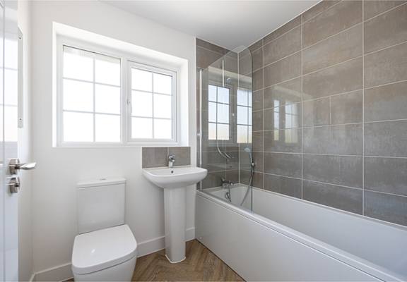 a bathroom with a sink toilet and a bath tub