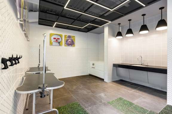 A kitchen with a table and a sink. at Coda at Bryant Street, Washington, DC 20002